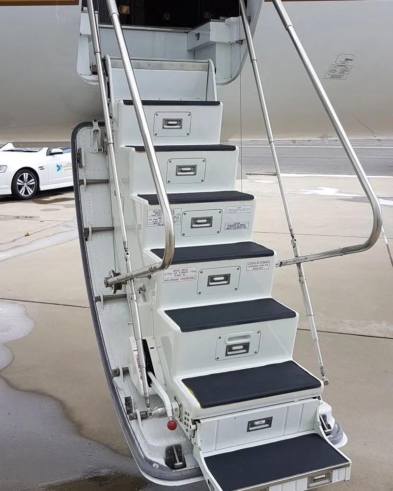 Freshly cleaned business jet airstair steps and handrail