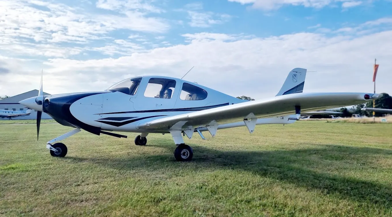 Cirrus SR22 on grass after exterior detailing