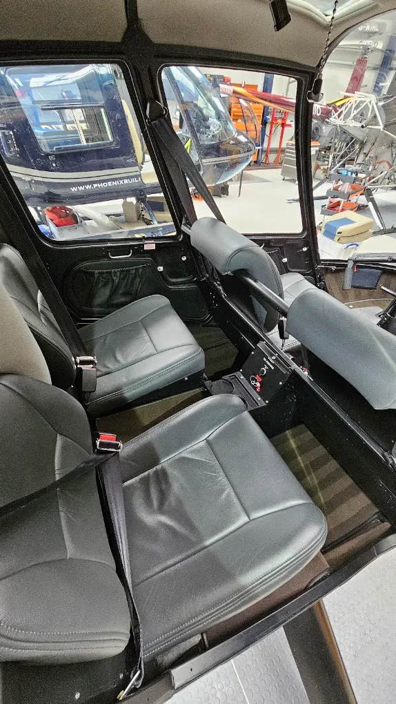 Helicopter cabin with grey leather seating after interior detailing