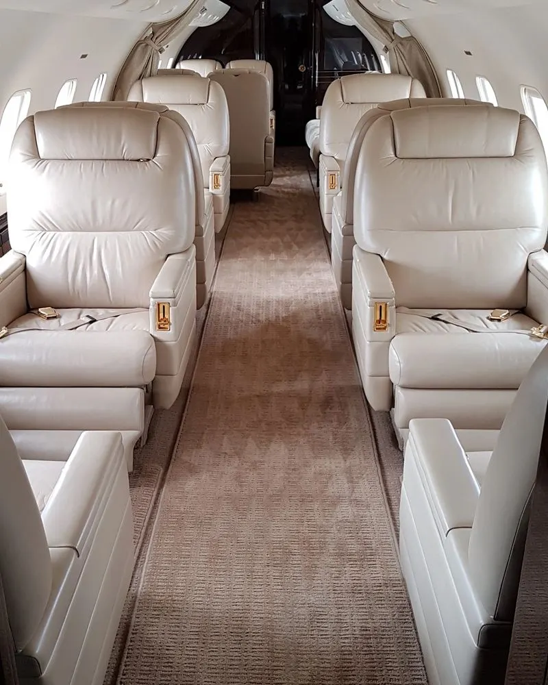 Looking down the aisle of a freshly detailed large-cabin jet