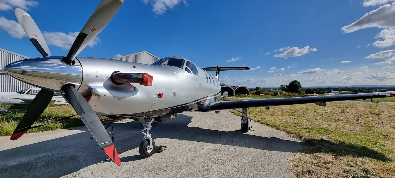 Pilatus PC-12 exterior with propeller against a blue sky